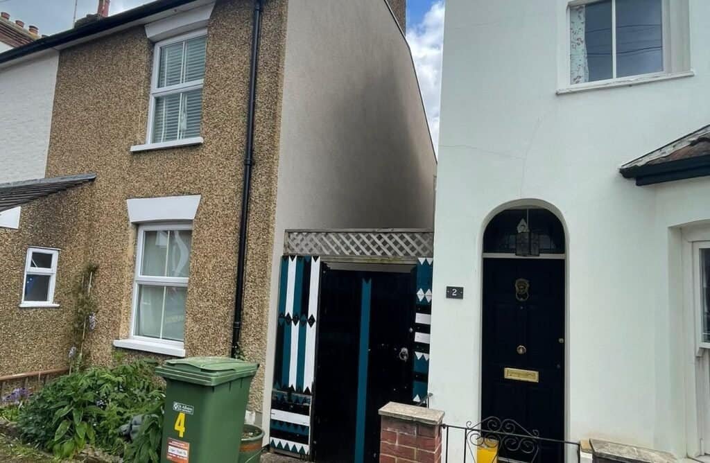 Wall Insulated House next to a rendered house in London street